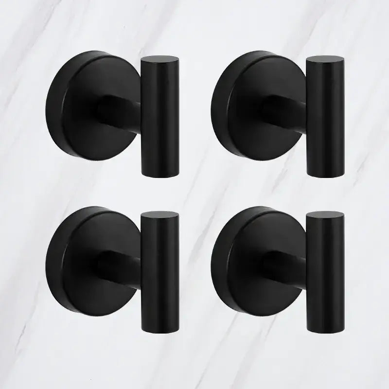 Set of four matte black wall-mounted towel hooks with a modern, minimalist design.