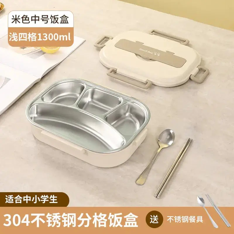 Beige 304 stainless steel compartmentalized lunchbox with a lid featuring beige handles and a silver-colored latch, designed for中小学生 (primary/secondary school students) and including matching stainless steel utensils.