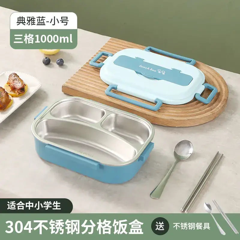 Light blue and white three-compartment stainless steel lunchbox with a matching lid, featuring sturdy handles for easy carrying.