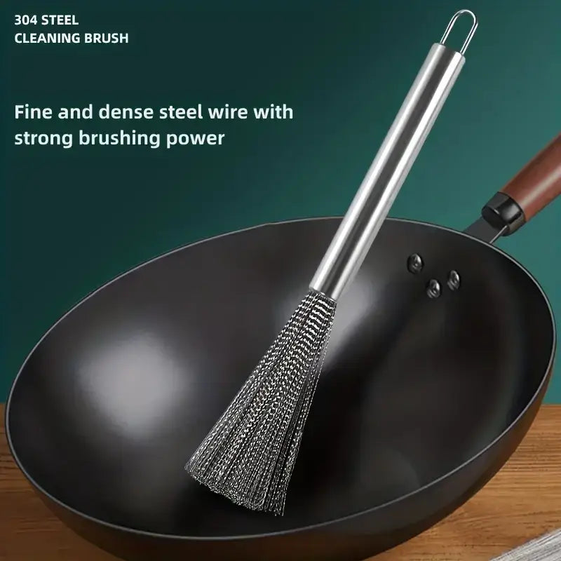 A sleek stainless steel cleaning brush with a polished handle and dense, fine wire bristles.