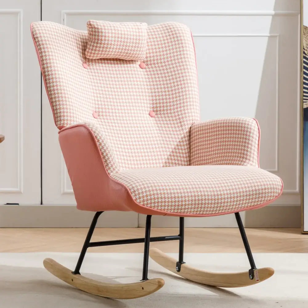 A pink and white houndstooth patterned rocking chair with a matching cushion, upholstered in fabric with contrasting rose-colored piping along the edges.