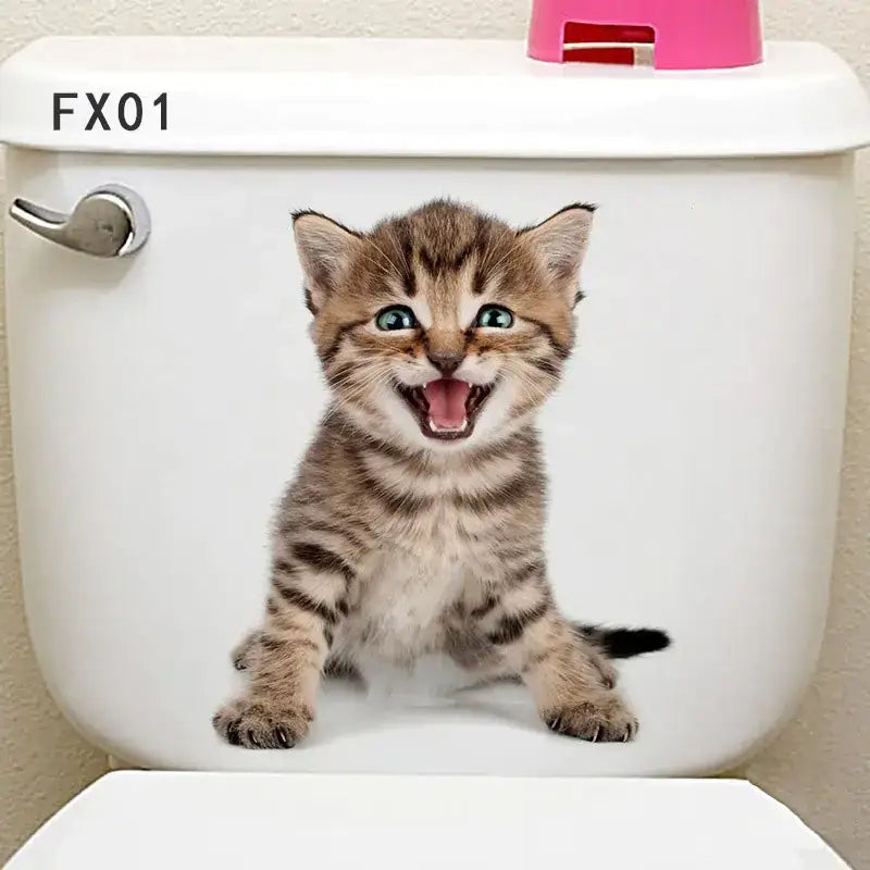White toilet tank featuring a realistic, smiling tabby kitten decal with striking blue eyes and brown stripes.