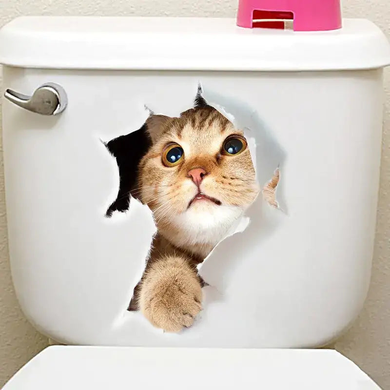 A realistic tabby cat face peeking through a torn hole on the white toilet tank.
