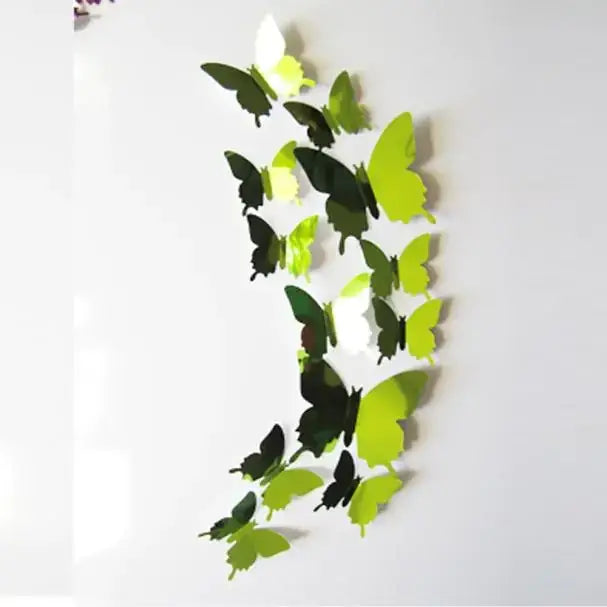 A set of glossy, three-dimensional butterfly wall decals in varying shades of green and black.
