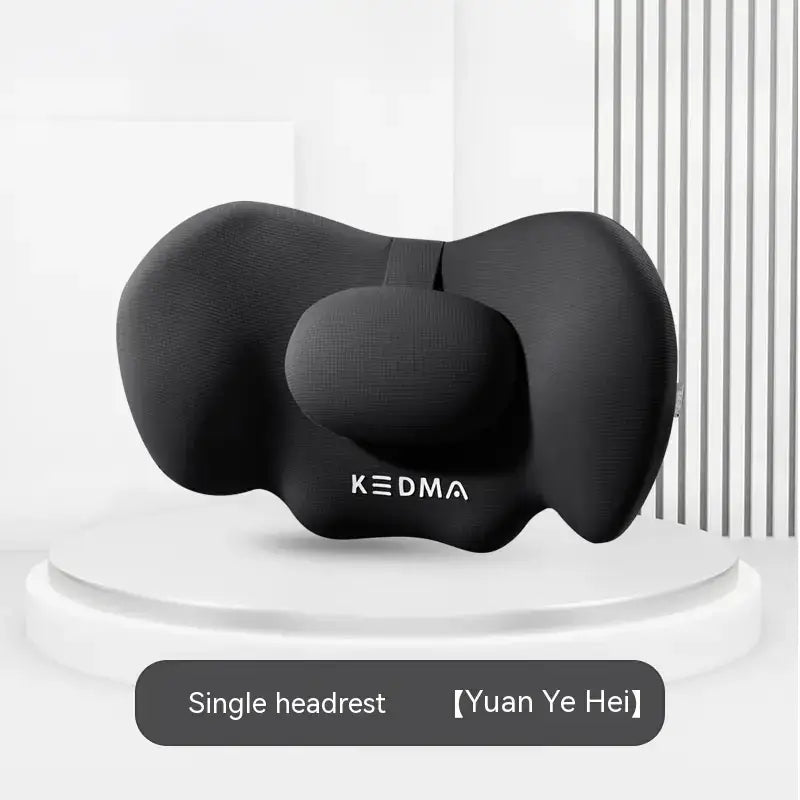 Black kedma single headrest with a contoured, ergonomic design for neck support.