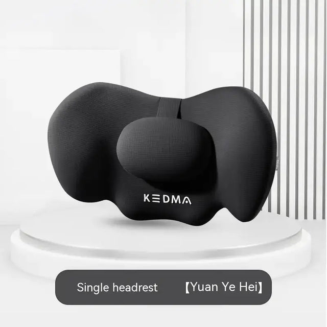 Black kedma single headrest with a contoured, ergonomic design for neck support.