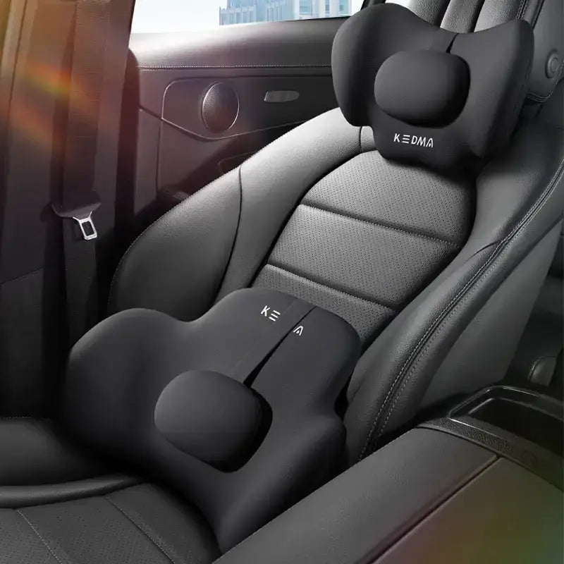 Black memory foam car seat cushion with contoured head and lumbar support, featuring the brand name ’kedma’ embroidered on both pieces