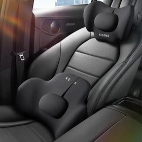 Black memory foam car seat cushion with contoured head and lumbar support, featuring the brand name ’kedma’ embroidered on both pieces
