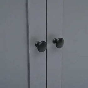 Black matte-finished round cabinet knobs.