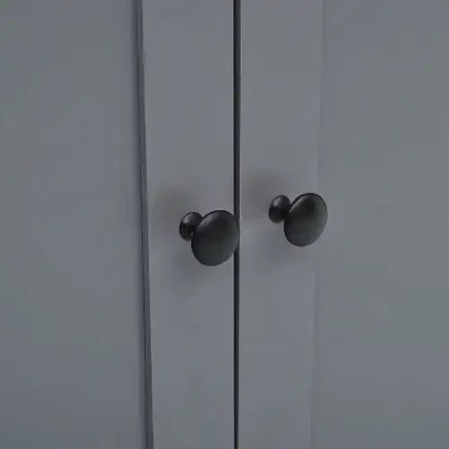 Black matte-finished round cabinet knobs.