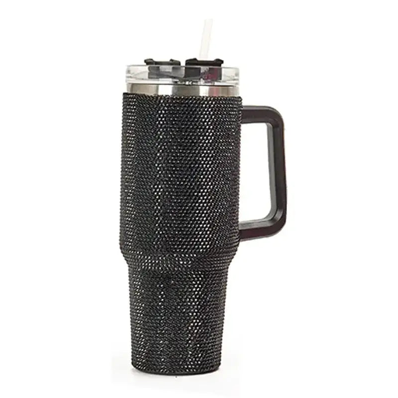 Black rhinestone-encrusted insulated tumbler with a clear lid, stainless steel rim, and black handle.