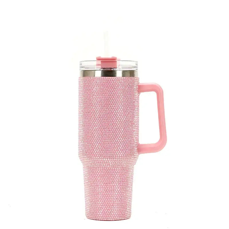 Pink rhinestone-encrusted insulated tumbler with a matching handle and clear lid.