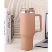 Beige insulated travel mug with a handle, clear lid and straw.