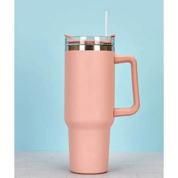 Pink insulated tumbler with a handle, clear lid, and straw.