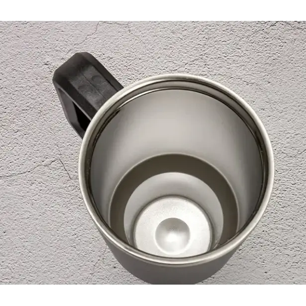 Silver stainless steel travel mug with a black plastic handle and a smooth, reflective interior.