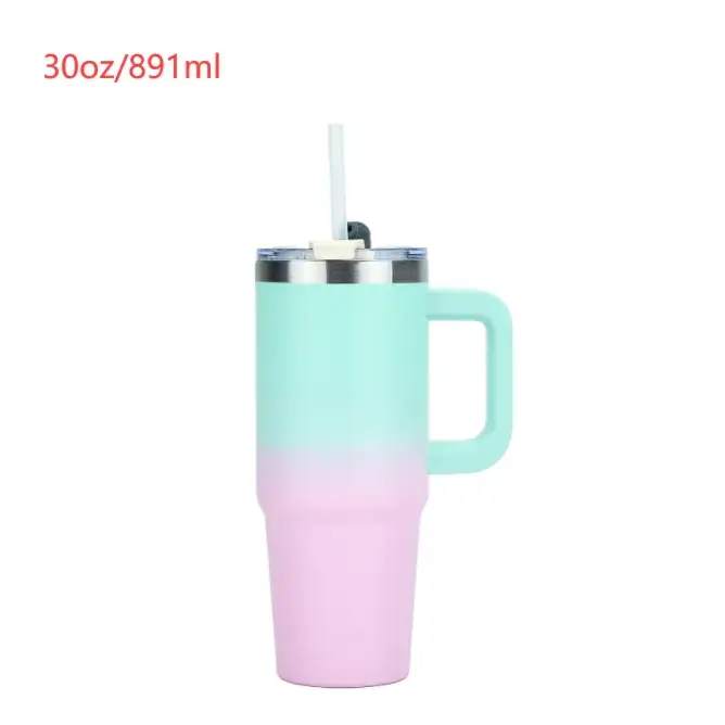 A pastel gradient insulated tumbler with a handle and straw, featuring an upper mint green to lower pink ombre finish.