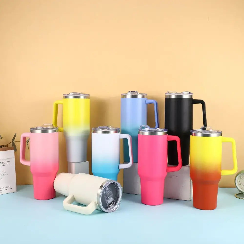 A collection of colorful gradient insulated tumblers with handles and stainless steel lids.