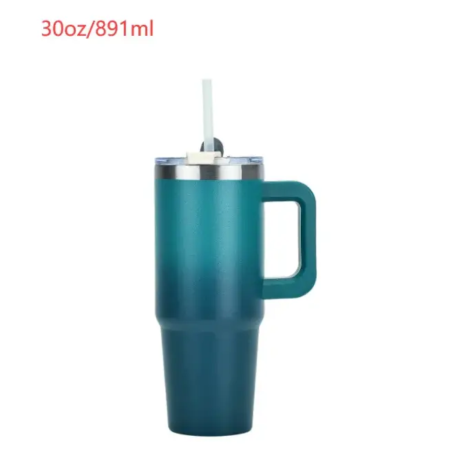 Teal gradient insulated tumbler with a handle and straw.