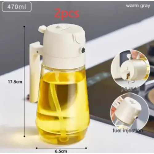White plastic oil dispenser with a handle and pump mechanism, filled with golden-yellow liquid.