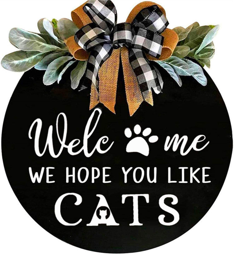 Black Round Wooden Welcome Sign with Bow Decor