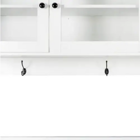 White cabinet with black knobs and two matching black hooks below.