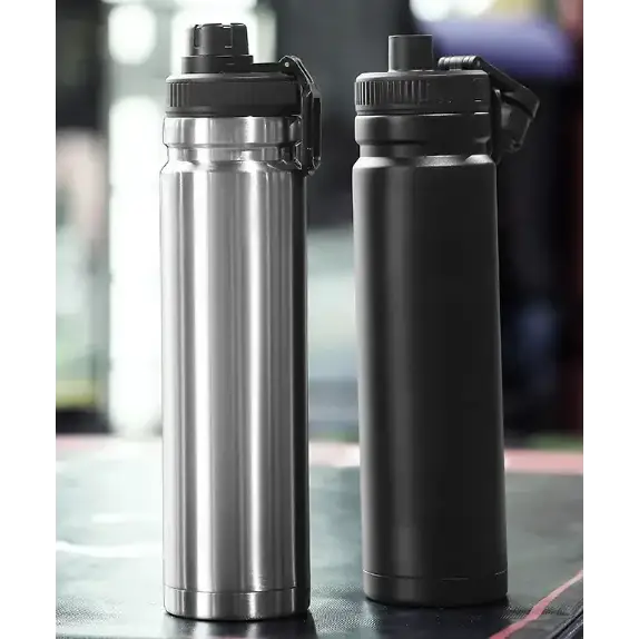 Two insulated water bottles, one with a shiny silver metallic finish and the other matte black, both featuring black screw-on lids with integrated carrying loops.