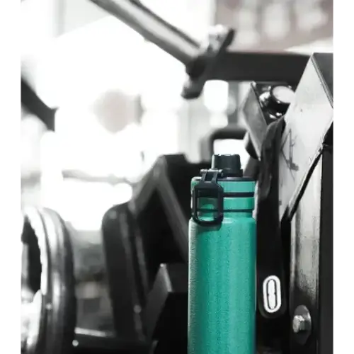 Teal textured water bottle with black screw-on lid and carrying loop.