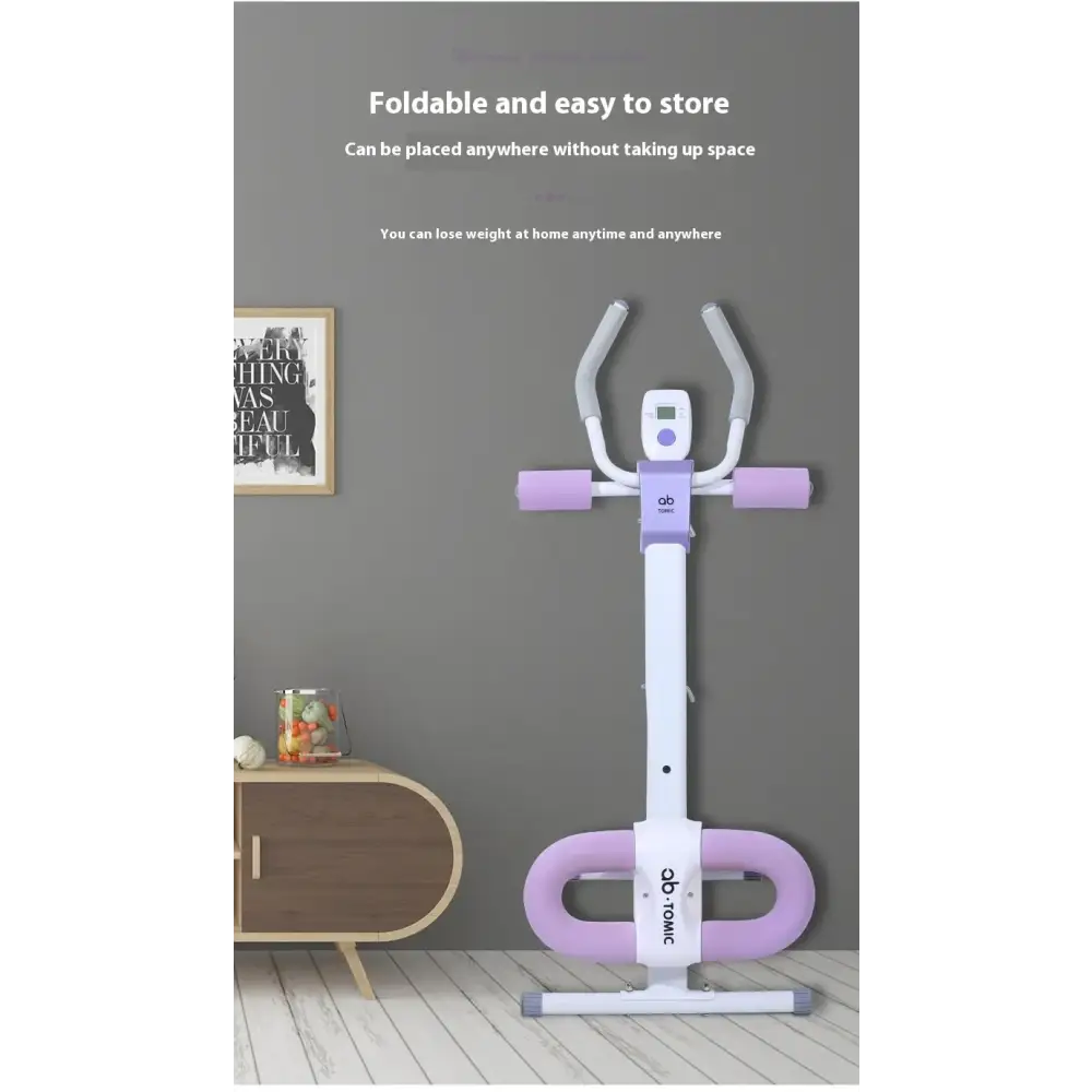 Purple and white foldable home exercise bike with a digital display.