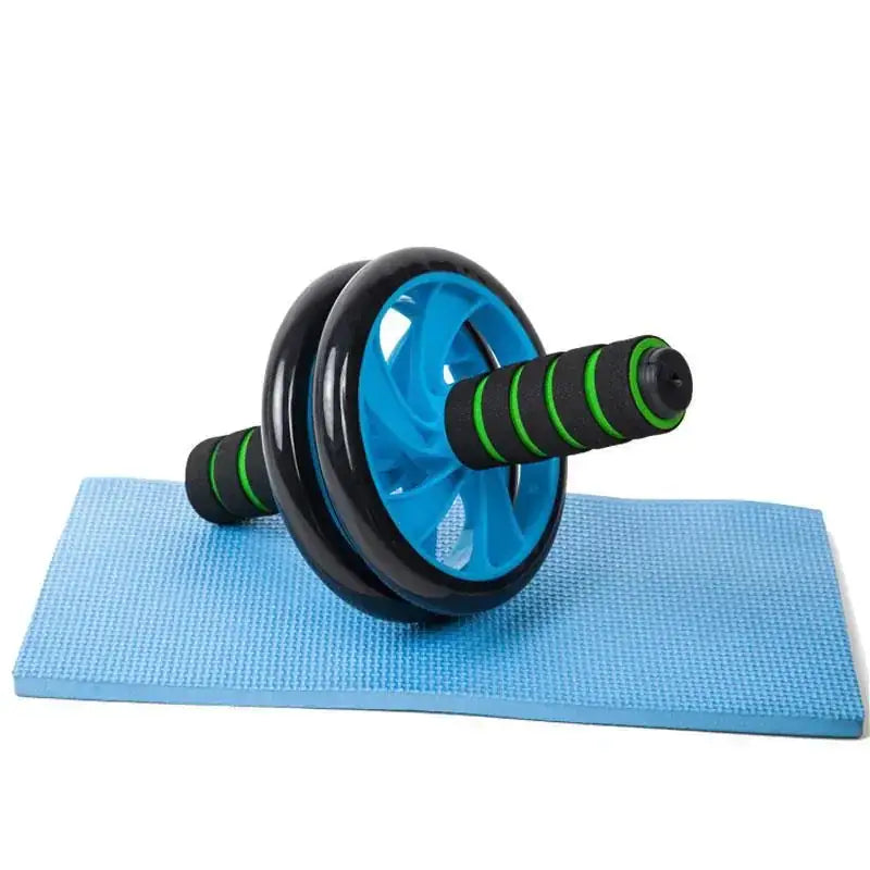 Blue and black ab roller with green striped handles resting on a light blue exercise mat.