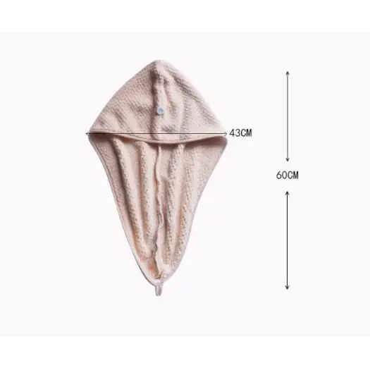 Beige textured microfiber hair drying hood with a button closure.