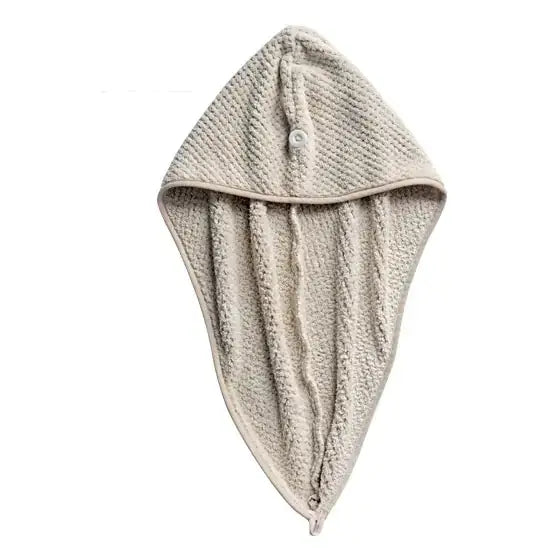Beige textured towel hood with button closure.