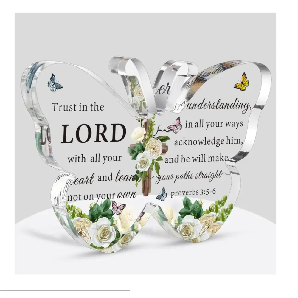 Clear acrylic butterfly-shaped decorative piece featuring engraved biblical verse from proverbs 3:5-6, adorned with printed white roses, green leaves, and small butterflies.