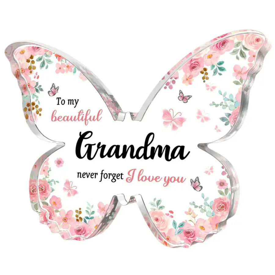 A translucent butterfly-shaped decorative plaque featuring a delicate floral pattern with pink roses and green leaves, accented by small butterflies in soft pastel hues.