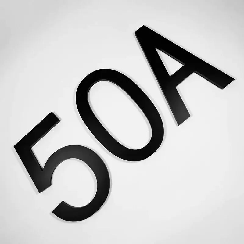 Black, matte-finished 3d house number plaque displaying ’50a’.