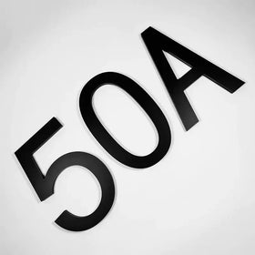 Black, matte-finished 3d house number plaque displaying ’50a’.