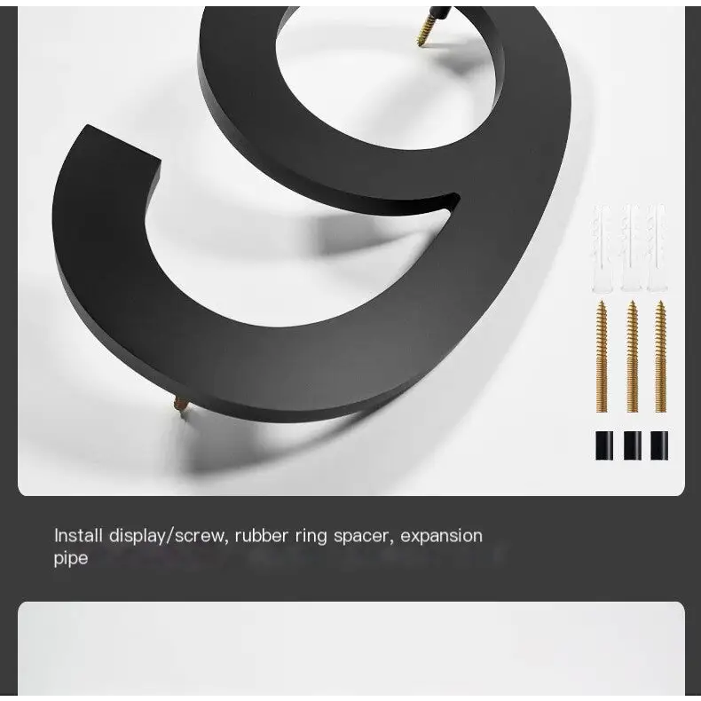 Black, three-dimensional number nine sign with a matte finish.