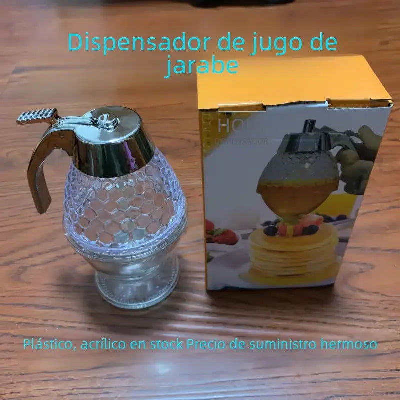 Clear honey dispenser with a silver-toned metal top and handle, featuring a textured hexagonal glass body.