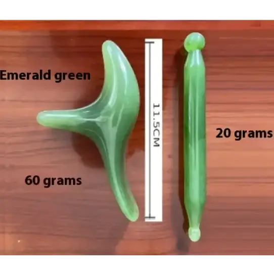 Emerald green jade facial massage tool with a curved, three-pronged head and a slender handle.