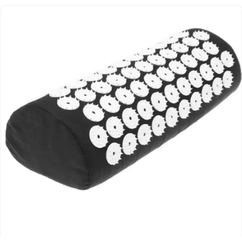 Black cylindrical massage pillow with white, circular acupuncture points embedded across its surface.