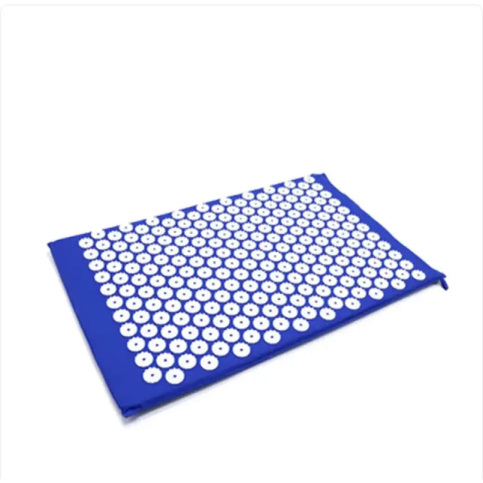 Blue acupressure mat with white circular needles arranged in a grid pattern.