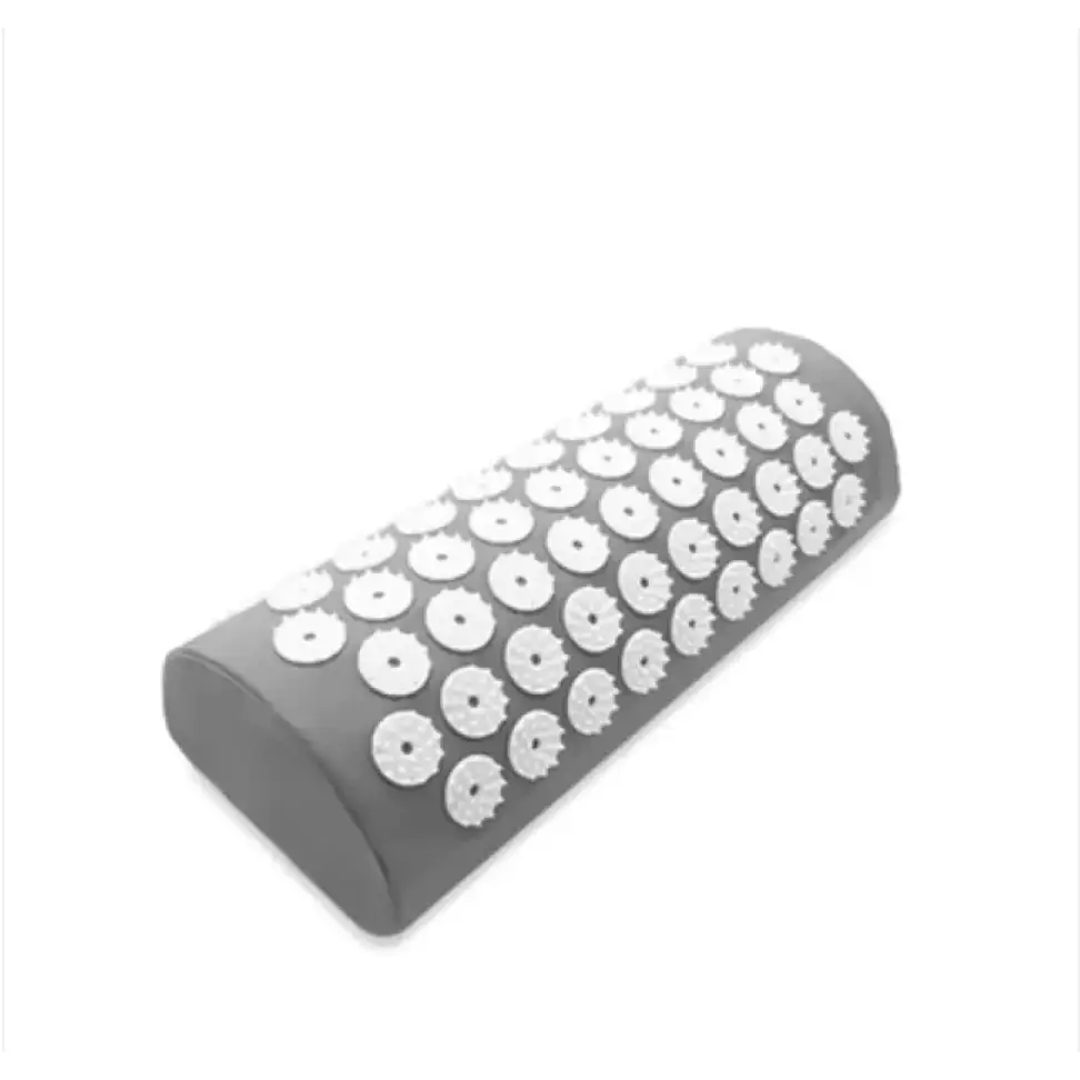 Gray cylindrical massage pillow with white, circular acupuncture points embedded across its surface.