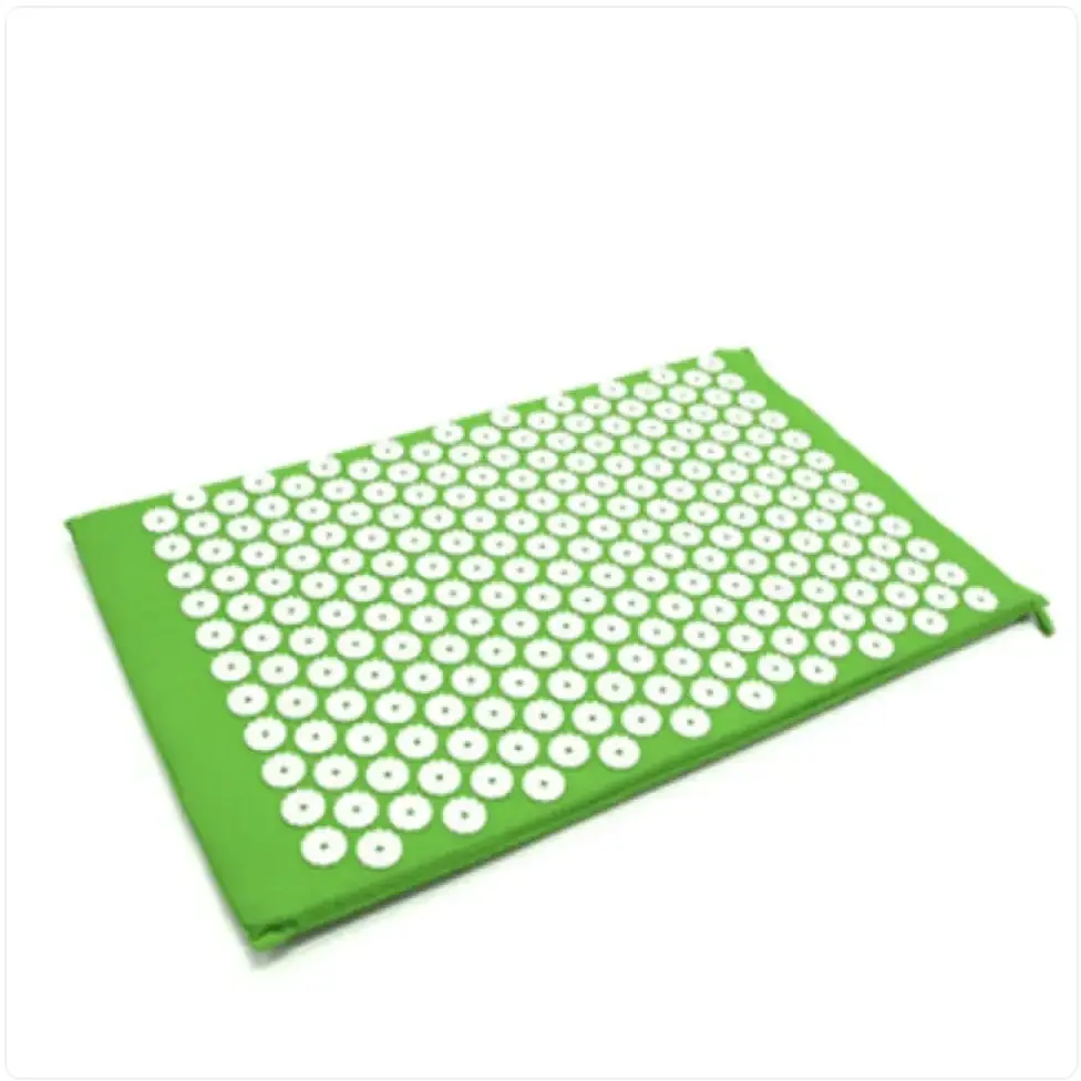 Green rectangular acupressure mat with a grid of white, circular pressure points.