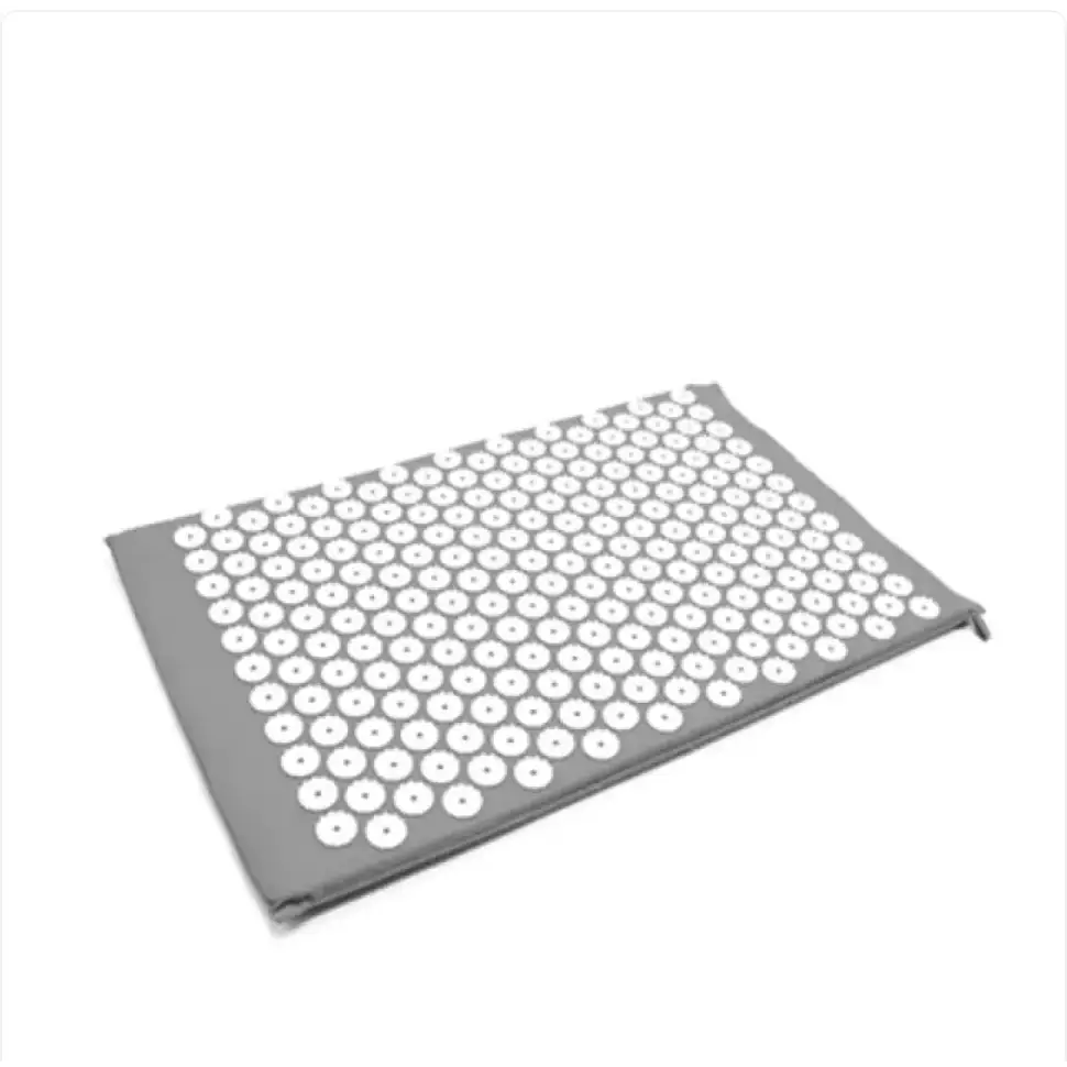 Gray massage mat with a grid of white acupressure needles.