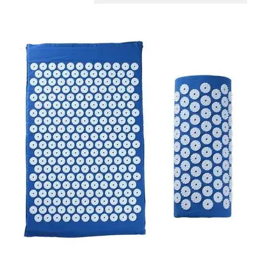 Blue acupressure mat and roller with white circular needles.