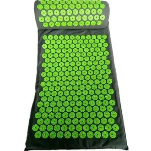 Green acupressure mat with a matching pillow, featuring evenly spaced circular spikes on a dark fabric base.