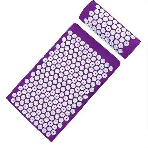 Purple acupressure mat with white circular needles arranged in a grid pattern.