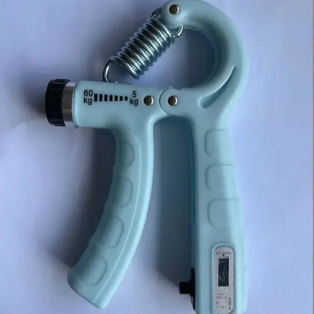 Light blue plastic hand gripper with a metallic spring and black adjustment knob, featuring weight indicators from 5 to 60 kg.