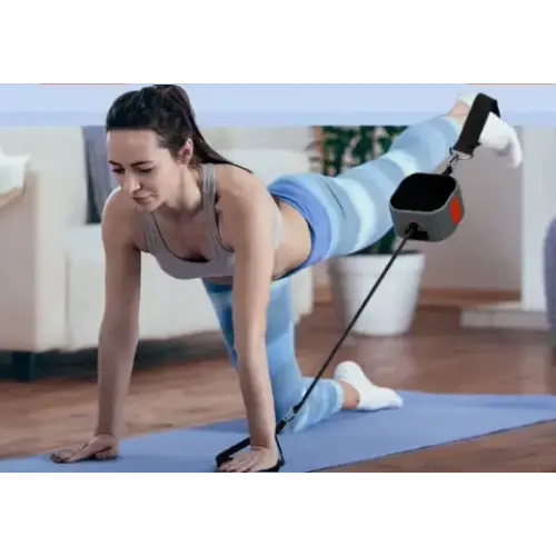 Gray and orange resistance band trainer with black strap attachments