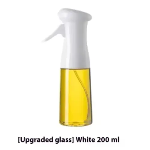White spray bottle with a clear glass body containing golden-yellow liquid.