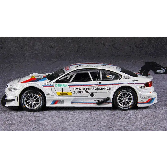 White bmw m4 dtm race car model with blue and red stripes, featuring sponsor decals including puma and adac.